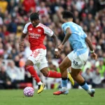 Noni Madueke sustains an injury against Man City